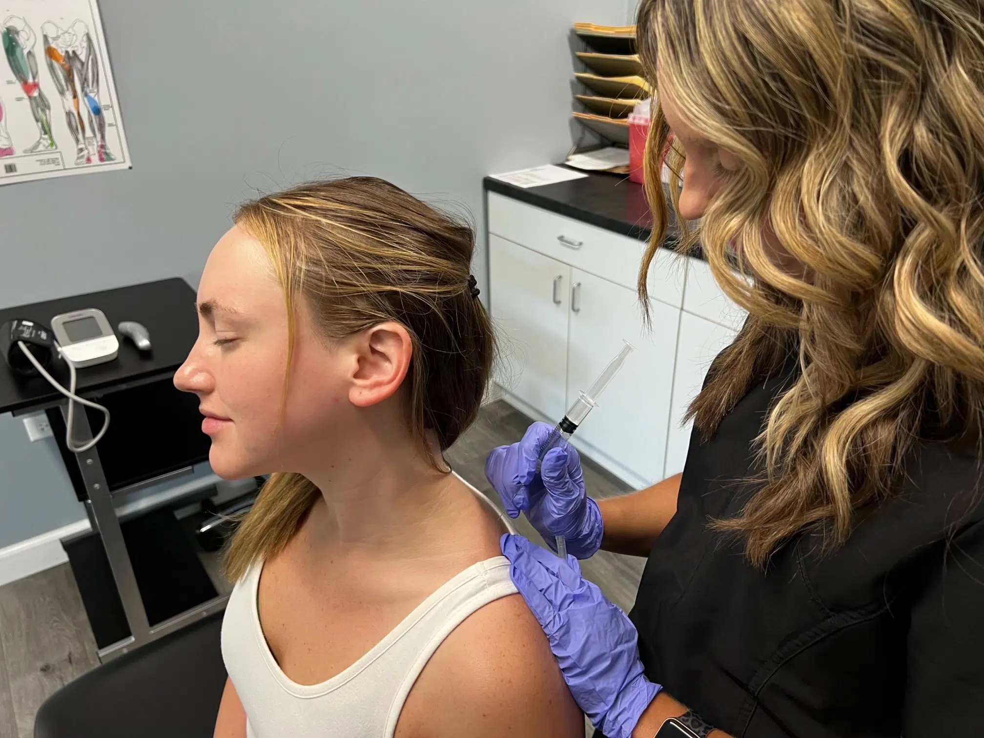 woman patient receiving trigger point injection