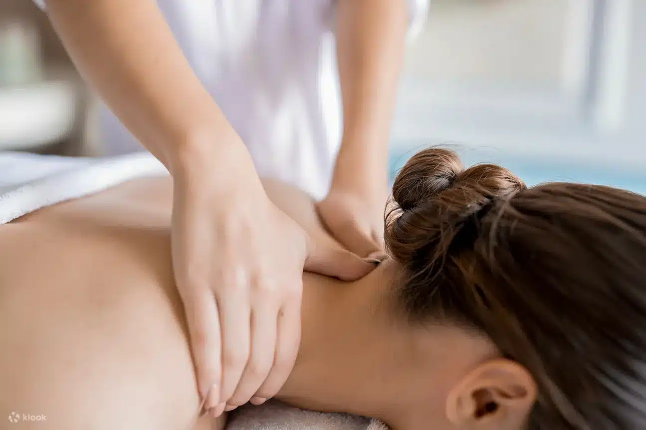 chiropractor giving patient a neck massage